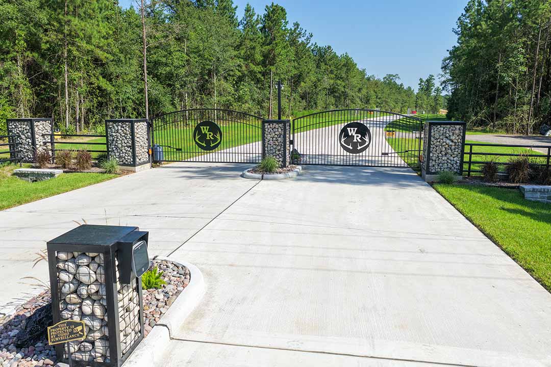 Black metal gated entrance at Whitetail Ranch